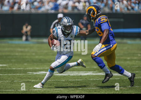 Carolina Panthers wide receiver D.J. Moore (12) looks for running room against Los Angeles Rams defensive end Dante Fowler (56) in the first half of an NFL football game in Charlotte, North Carolina on September 8, 2019. Photo by Nell Redmond/UPI. Stock Photo