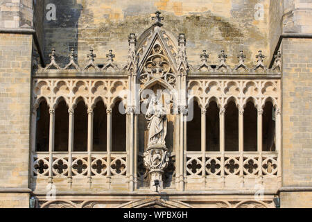 Statue of Madonna with Child above the main entrance of the 13th-century Gothic Basilica of Our Lady in Tongeren, Belgium Stock Photo