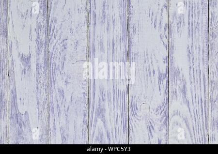 Wooden background texture. Creatively painted white and purple boards. Stock Photo