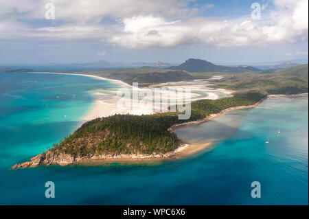 Aerial shot of Hill Inlet over Whitsunday Island - swirling white sands, sail boats and blue green water make spectacular patterns Stock Photo