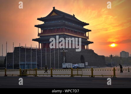 Tiananmen square 15th century Zhengyang gatehouse against dramatic sunset sky, Beijing, China Stock Photo