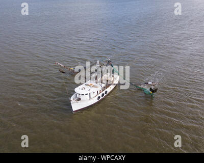 Aerial close up view of shrimp boat at sea Stock Photo