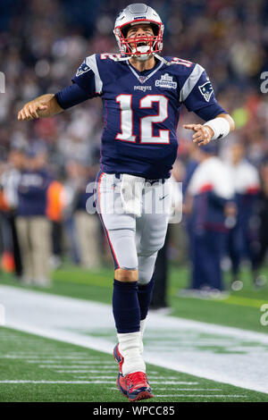 New England Patriots quarterback Tom Brady (12) smiles on the sideline in  the fourth quarter against the Houston Texans at Gillette Stadium in  Foxborough, Massachusetts on December 10, 2012. The Patriots defeated