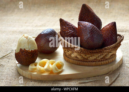 salak fruit or snake fruit native to java island on bamboo basket Stock Photo