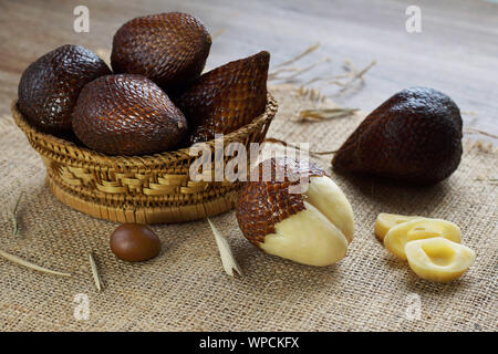 salak fruit or snake fruit native to java island on bamboo basket Stock Photo