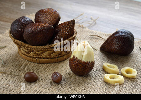salak fruit or snake fruit native to java island on bamboo basket Stock Photo