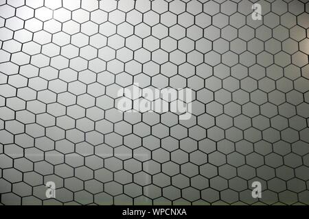 Close up of soccer net with faint outline of the opposite goal post. Stock Photo