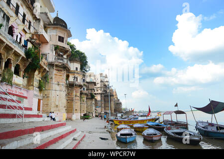 The colorful ghats on the banks of the Ganges river in Varanasi. Stock Photo