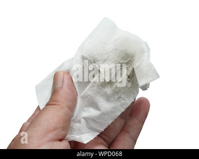 Black stain on paper towel in the hand isolated on white background, Dirt from wiping and cleaning Stock Photo