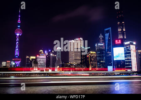 Shanghai, China. 08th Sep, 2019. View from the promenade 'The Bund' at the Huangpu river to the illuminated skyline of the special economic zone Pudong with skyscrapers. On the left you can see the Oriental Pearl Tower and on the right the Shanghai Tower. Credit: Swen Pförtner/dpa/Alamy Live News Stock Photo