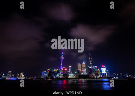 Shanghai, China. 08th Sep, 2019. View from the promenade 'The Bund' at the Huangpu river to the illuminated skyline of the special economic zone Pudong with its skyscrapers. On the left you can see the Oriental Pearl Tower and on the right the Shanghai Tower. Credit: Swen Pförtner/dpa/Alamy Live News Stock Photo