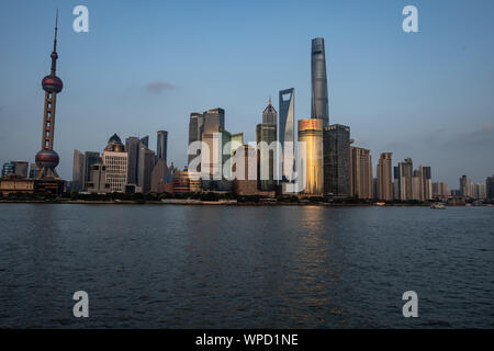 Shanghai, China. 08th Sep, 2019. View from the promenade 'The Bund' at the Huangpu river to the skyline of the special economic zone Pudong with its skyscrapers. On the left you can see the Oriental Pearl Tower and on the right the Shanghai Tower. Credit: Swen Pförtner/dpa/Alamy Live News Stock Photo
