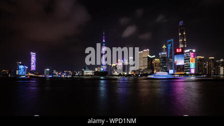 Shanghai, China. 08th Sep, 2019. View from the promenade 'The Bund' at the Huangpu river to the illuminated skyline of the special economic zone Pudong with its skyscrapers. On the left you can see the Oriental Pearl Tower and in the middle the Shanghai Tower. Credit: Swen Pförtner/dpa/Alamy Live News Stock Photo