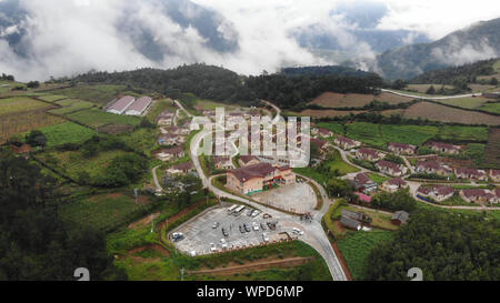 (190909) -- MIANNING, Sept. 9, 2019 (Xinhua) -- Aerial photo taken on July 16, 2019 shows the view of Yihai Village in Mianning County, Liangshan Prefecture, southwest China's Sichuan Province. In recent years, the development of red tourism, which refers to visits to historical sites with a revolutionary legacy, has helped improve the employment rate and increase the incomes of local villagers in Yihai Village. With the establishment of the red tourism scenic area and the implementation of poverty relief policies, more than 110 poverty-stricken families in the village has got out of poverty. Stock Photo