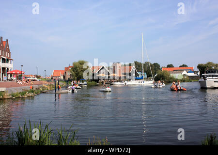 People enjoying outdoor dining in Volendam on a warm sunny day in summer. Volendam, North-Holland, The Netherlands Stock Photo