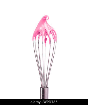 Metal whisk with pink cream isolated on black background. Clipping path. Stock Photo