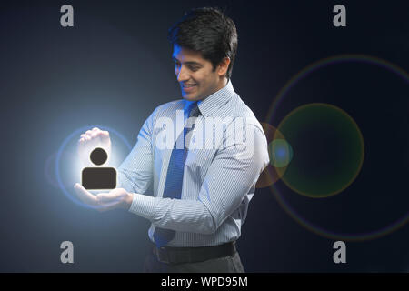 Businessman protecting the user interface Stock Photo