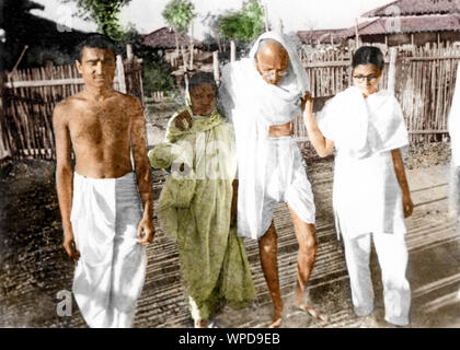 Mahatma Gandhi walking with Kanu Gandhi and Abha Gandhi, Wardha, India, Asia, 1936 Stock Photo