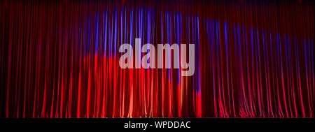 Red curtains panorama closed and the lights to a scene. Stock Photo