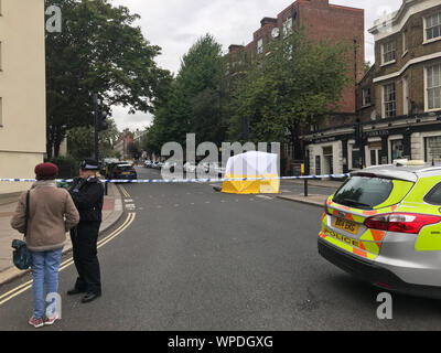 The scene at the junction of Malden Road and Prince of Wales Road, Kentish Town, north-west London, where a man was found with a gunshot wound after police, including armed officers, were called to a shooting late on Sunday night. Stock Photo