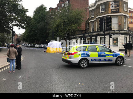 The scene at the junction of Malden Road and Prince of Wales Road, Kentish Town, north-west London, where a man was found with a gunshot wound after police, including armed officers, were called to a shooting late on Sunday night. Stock Photo