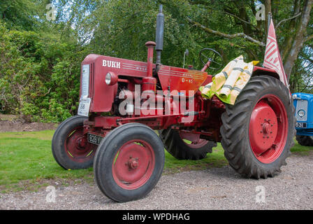 Dull Red 1959 Danish Bukh D45 Model Tractor Isle of Bute Scotland United Kingdom front passengers  left hand side nearside view old dull red veteran 1 Stock Photo