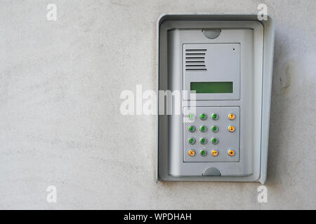 security device intercom on exterior wall of residential building Stock Photo