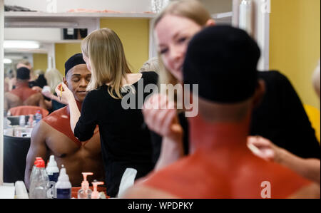 Hamburg, Germany. 14th Aug, 2019. The South African singer Hope Maine is made up in the mask. As the first cast he plays the Simba in the Hamburg production of the musical 'König der Löwen'. Credit: Markus Scholz/dpa/Alamy Live News Stock Photo