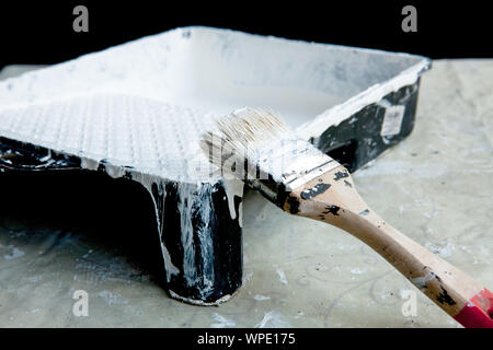 White paint, brush and tray, for painting white ceiling or trim Stock Photo