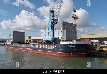 Poole Harbour, Dorset, England, UK. September 2019. The Valiant a general cargo vessel unloading from her berth in Poole Harbour. Stock Photo