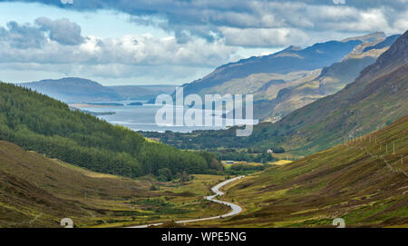 LOCH MAREE WESTER ROSS HIGHLANDS SCOTLAND VIEW OVER THE LOCH AND WINDING ROAD IN LATE SUMMER Stock Photo