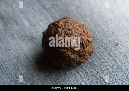 “Cocagne” ball, ball obtained from crushed pastel leaves, to obtain the blue dye. Stock Photo