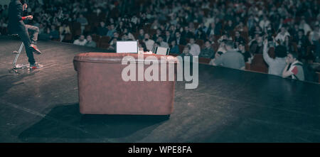 Rear view of speaker giving a talk on corporate Business Conference. Stock Photo