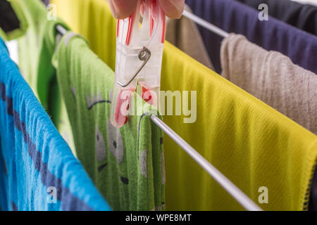 Laundry is hung in the household on a drying rack Stock Photo