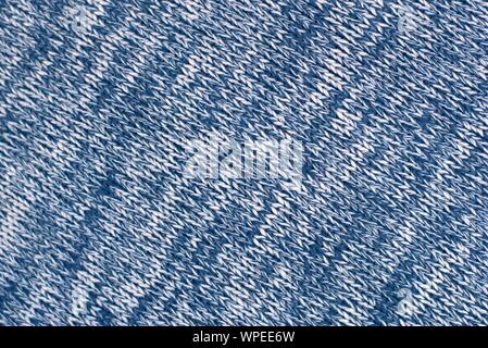 Mottled blue and white woollen sweater. Texture detail close up. Stock Photo
