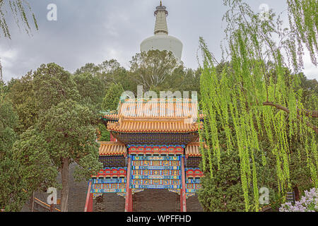 Standing in front of the White Pagoda on Qionghua Island in Beihai Park in Beijing Stock Photo