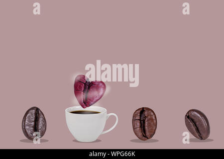 A cup of coffee beans and pink heart coffee bean floats over the glass with smoke isolatted on pink background, Valentine and love concept. Stock Photo