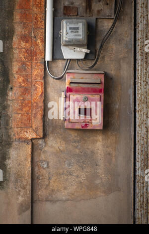Ancient Thailand post box on the stucco wall. Stock Photo