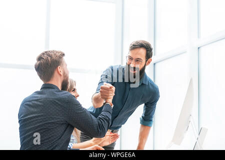 employees showing their success while working together Stock Photo