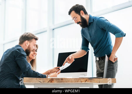 young professionals work with business documentation in the new office Stock Photo
