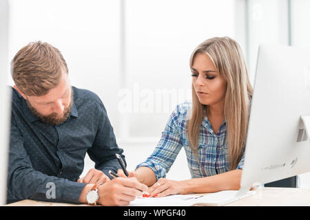 close up. business colleagues checking financial report Stock Photo