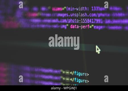 Selective closeup shot of data codes on a computer monitor screen Stock Photo