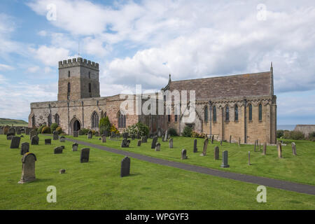 St Aidan's Church in the village of Bamburgh on the Northumberland coast, UK Stock Photo