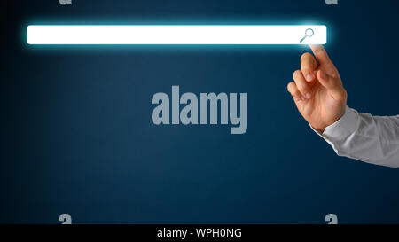 Male hand touching a white glowing empty search bar over navy blue background. Stock Photo