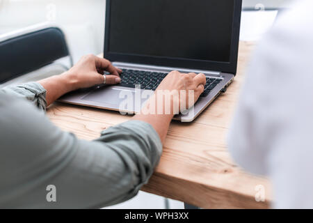 close up. businessman typing on the keyboard laptop. Stock Photo
