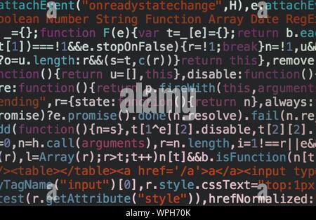 Selective closeup shot of data codes on a computer monitor screen Stock Photo