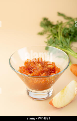 Apple and carrots confiture in glass bowl Stock Photo
