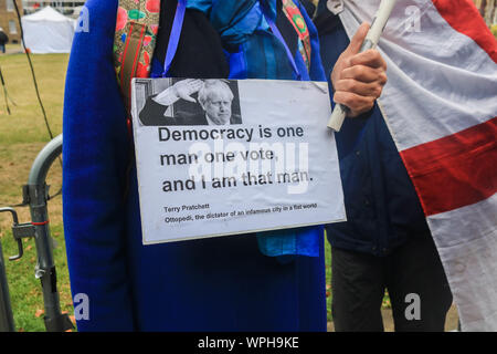 Westminster London, UK. 9th September 2019. A Pro remain  protester  wears a sign outside Parliament as Prime Minister Boris Johnson  plans to shut down Parliament tonight  until 14 October   Credit: amer ghazzal/Alamy Live News
