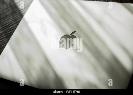 MacBook Air on sunny table. Stock Photo