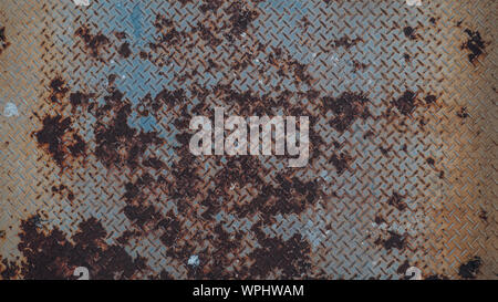 Rusty stain on checkered steel plates texture graphic background idea material. Stock Photo